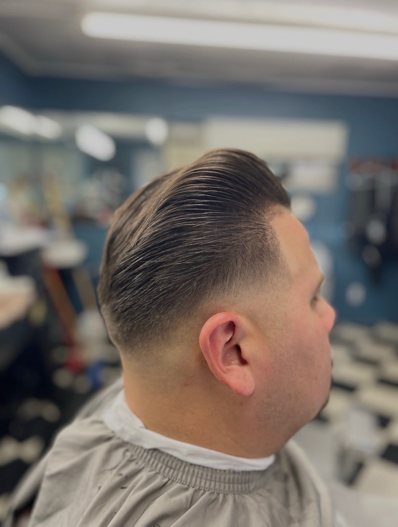 Classic Comb-Over Fade haircut by Dapper B's Barbershop